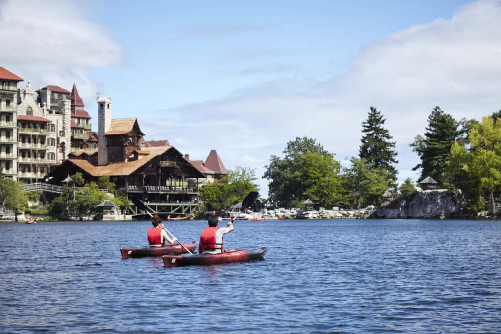 Scenic view of Mohonk Lake surrounded by fall foliage